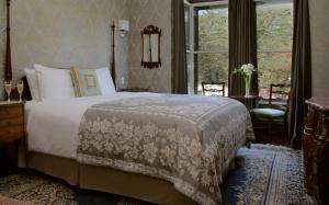 a bedroom with a large bed and a window at Monte Cristo Bed and Breakfast in San Francisco