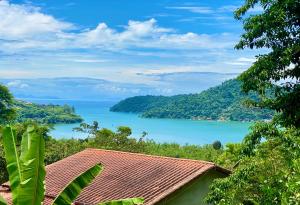 a view of a lake from a house at Casa Tambor Paraty in Paraty