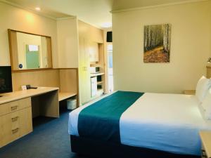 Postel nebo postele na pokoji v ubytování Comfort Inn Glenelg