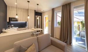 TV a/nebo společenská místnost v ubytování Residence Casa Coppa Appartamento Iris