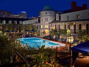 a large building with a balcony overlooking the ocean at The Royal Sonesta New Orleans in New Orleans