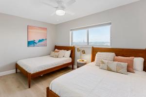 Voodi või voodid majutusasutuse Cocoa Beach Towers toas
