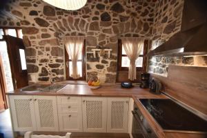 Kuchyň nebo kuchyňský kout v ubytování Patriko Nisyrian Guesthouse
