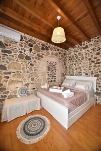Postel nebo postele na pokoji v ubytování Patriko Nisyrian Guesthouse