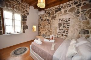 Postel nebo postele na pokoji v ubytování Patriko Nisyrian Guesthouse