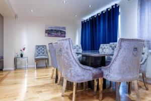 a dining room with a table and chairs at Lux Ulverston in Broughton