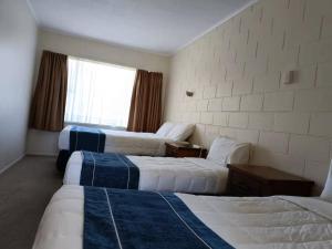 Voodi või voodid majutusasutuse Astral Motel toas