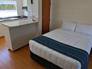 Voodi või voodid majutusasutuse Astral Motel toas