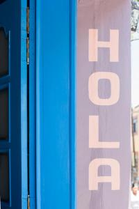 a sign on the side of a building at Un Sueño Valle de Huajes in Oaxaca City