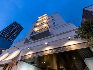 a building with a hotel door sign on it at Hotel Dorf Shizuoka in Shizuoka