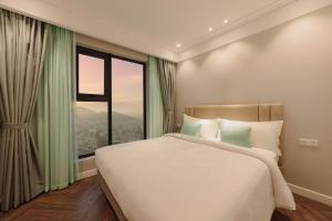 Postel nebo postele na pokoji v ubytování Altara Luxury Residences Quy Nhon + 43 fotografií