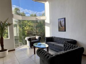 Posezení v ubytování Herradura VIP Inn