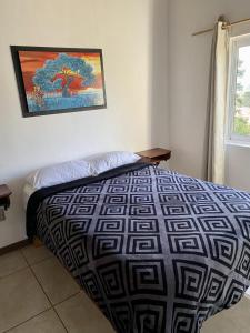 Postel nebo postele na pokoji v ubytování Herradura VIP Inn