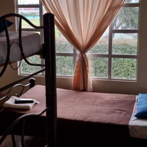 Postel nebo postele na pokoji v ubytování Hotel Susagua + 6 fotografií