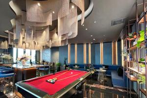 a billiard room with a pool table in it at Edge Central Pattaya by J&P in Pattaya Central