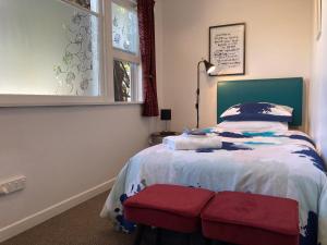 Ένα ή περισσότερα κρεβάτια σε δωμάτιο στο Gisborne Dream Suite