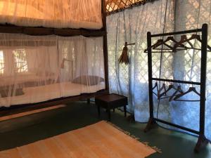 Bhakti Kutir客房内的一张或多张床位