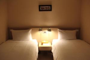 Katil atau katil-katil dalam bilik di Mellow Fields Hotel