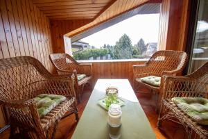 a room with a table and chairs and a window at Garden Apartments Janša in Radovljica