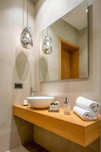 a bathroom with a sink and a mirror at Ligaria Mare in Agia Pelagia