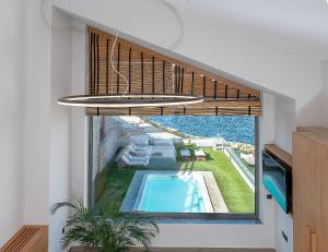 a view of a swimming pool from a house at Ligaria Mare in Agia Pelagia