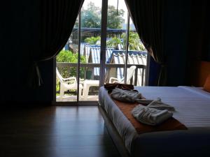 Letto o letti in una camera di Andaman Resort