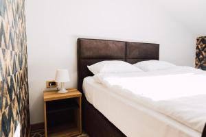 Postel nebo postele na pokoji v ubytování Hotel Livnica