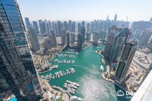 a view of a harbor in a city with boats at Dream Inn Dubai - Damac Heights Marina in Dubai