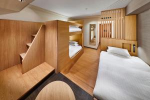 a bedroom with a bed and a desk at Shiba Park Hotel in Tokyo
