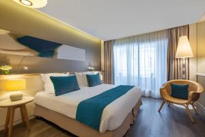 Postel nebo postele na pokoji v ubytování Hôtel Le B d'Arcachon by Inwood Hotels