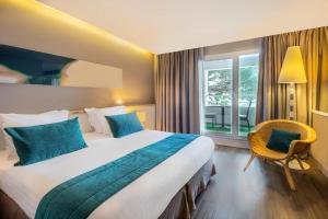 Postel nebo postele na pokoji v ubytování Hôtel Le B d'Arcachon by Inwood Hotels