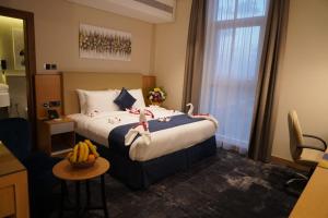 Postel nebo postele na pokoji v ubytování AL HAYAT HOTEL