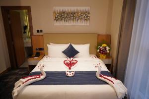 Postel nebo postele na pokoji v ubytování AL HAYAT HOTEL