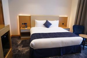 Postel nebo postele na pokoji v ubytování AL HAYAT HOTEL