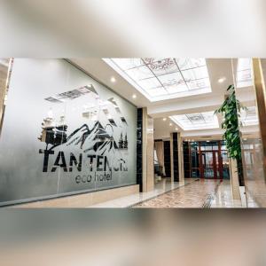 a lobby with a sign on the wall of a building at Eco Hotel Tan Tengri in Kostanay