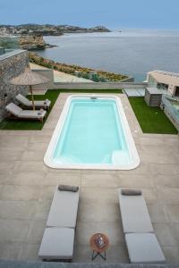 a swimming pool on the roof of a house at Ligaria Mare in Agia Pelagia