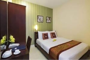 Postel nebo postele na pokoji v ubytování Sen Sai Gon Hotel - Ben Thanh Market