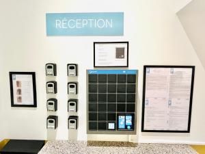 a display of an iphone ev detection machine at Elberg Hotel & Apartments in Mouscron