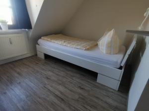 Ein Bett oder Betten in einem Zimmer der Unterkunft Ferienwohnungen Bergstrasse