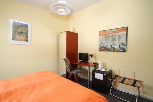 TV a/nebo společenská místnost v ubytování Igdlo Guesthouse
