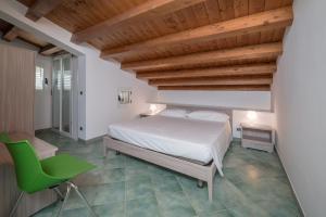 Postelja oz. postelje v sobi nastanitve Archimede, appartamento con vista in centro a Marina di Ragusa