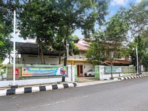 a building on the side of a street at SPOT ON 90744 Alika Homestay in Demak