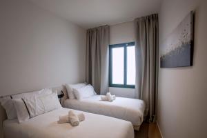 Posteľ alebo postele v izbe v ubytovaní NC APARTMENTS RAMBLA3