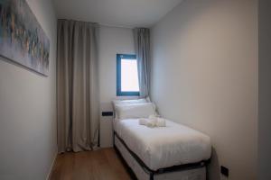 Posteľ alebo postele v izbe v ubytovaní NC APARTMENTS RAMBLA3