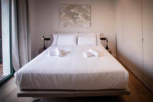 Posteľ alebo postele v izbe v ubytovaní NC APARTMENTS RAMBLA3