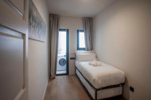 Posteľ alebo postele v izbe v ubytovaní NC APARTMENTS RAMBLA3