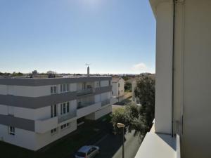 a view of a building from a balcony at Réter in Aytré