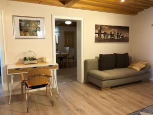 a living room with a couch and a table at Ferienwohnung Völkl in Böbrach