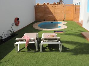 The swimming pool at or close to COZY, Beach House , by MAHBOVILLAS