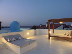 A balcony or terrace at COZY, Beach House , by MAHBOVILLAS